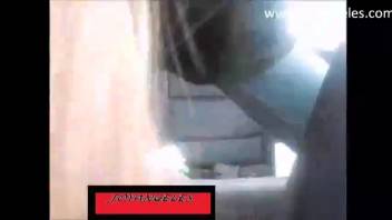 Young woman defecating in the rear seat of the vehicle